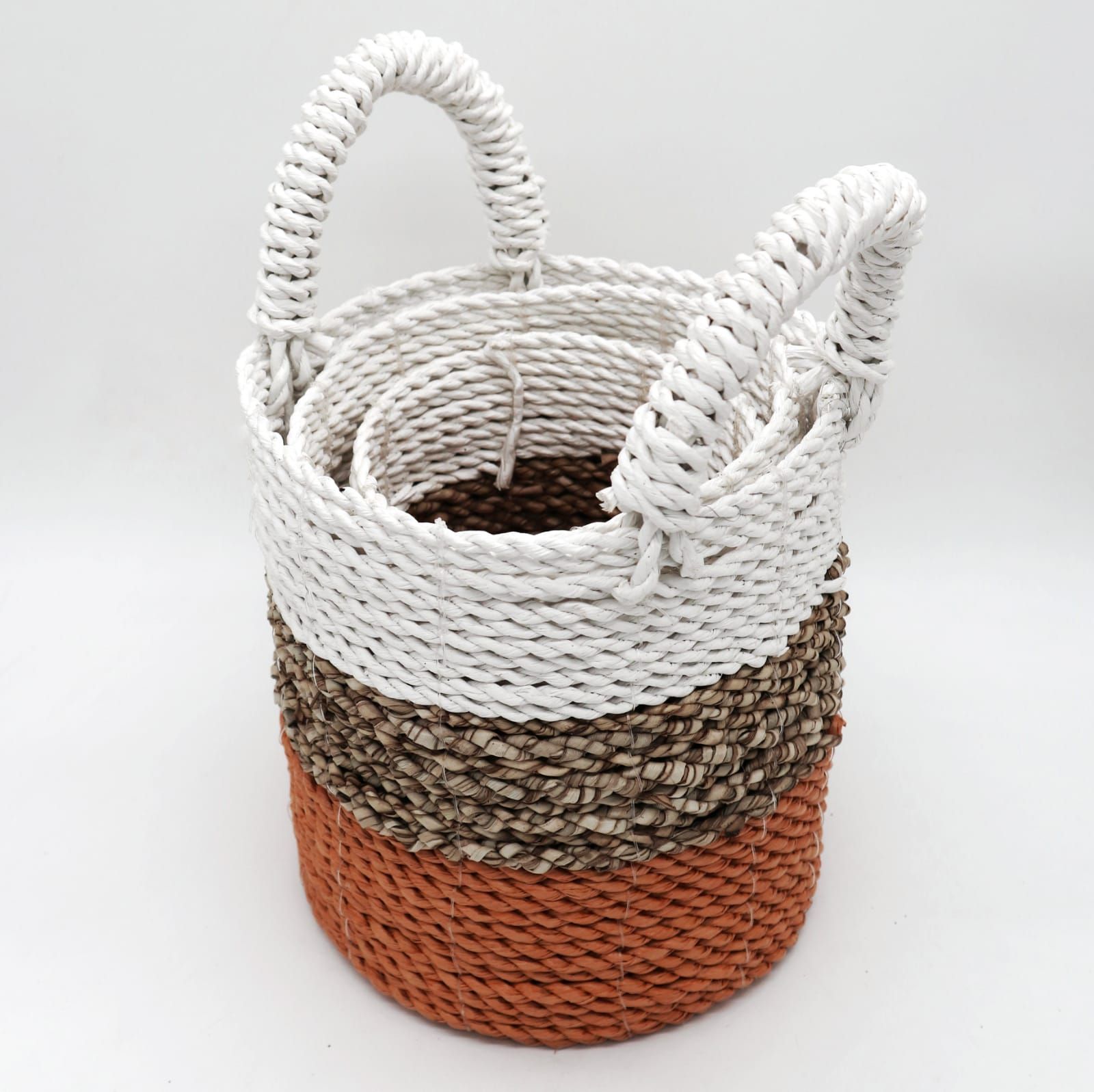 Orion Handcrafted Seagrass Basket Trio in warm orange